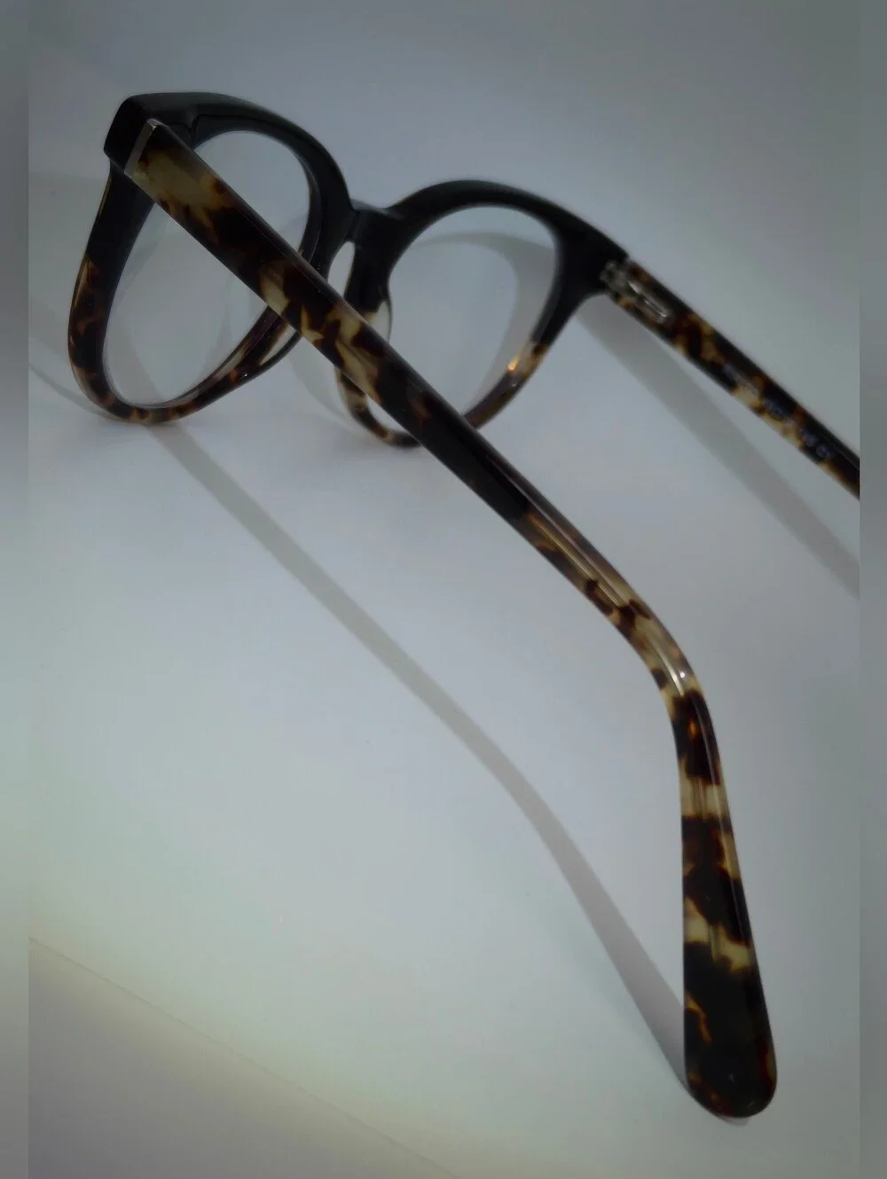 Rialto. Classic Round Black Upper, Animal Print Lower And Temples.